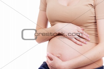 pregnant woman touching her belly with her hands