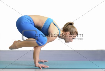 woman in yoga pose standing on her hands