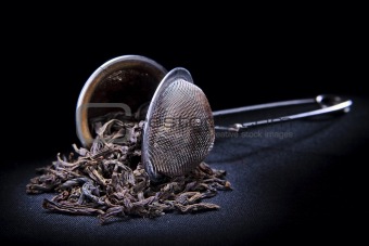 strainer with tea leafs