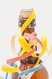 Studio shot of cider bottle with party streamers