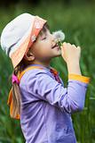 cheerful girl with dandelion
