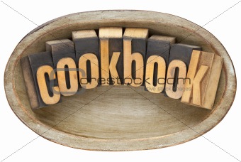 cookbook in wooden bowl