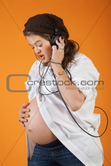 Pregnant Woman With Headphones