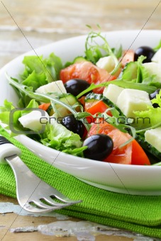 Greek salad with olives, tomatoes and feta cheese