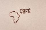 Coffee beans on canvas in the shape of Africa and Cafe