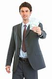 Modern business man showing pack of euros