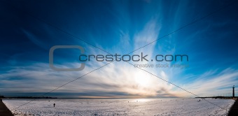 Beautiful cloudy sky panorama over ice