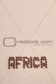 The word Africa written with coffee beans on canvas 