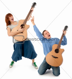 Young couple playing guitar 