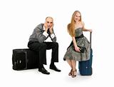 young couple with travel cases isolated on white background