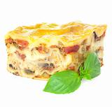 Home-baked hot Lasagne with fresh Basil / isolated on white
