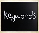 The word "Keywords" handwritten with white chalk on a blackboard