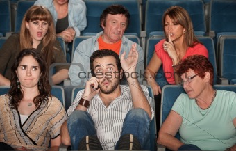 Audience Angry With Man on Phone