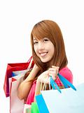 smiling woman holding shopping bag isolated on white