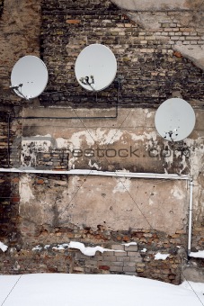 Satellite dishes on a wall
