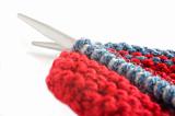Woollen thread and knitting needle. Needlework accessories on white background.
