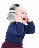 young laughing child with ear-phones listening to music