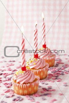 Pink muffins with candles