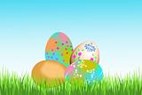 Colorful Easter eggs on green grass and white isolated background
