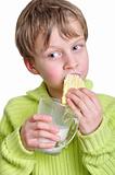child eating cake and dringking milk