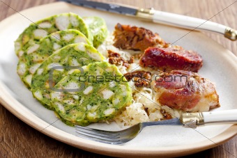 pork meat with herbal dumplings and cabbage