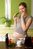 Pregnant Woman On Kitchen