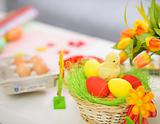 Closeup on table with Easter eggs and decoration stuff