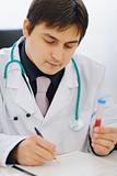 Medical doctor working with blood sample