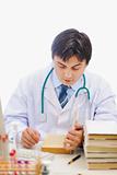 Medical doctor studying books