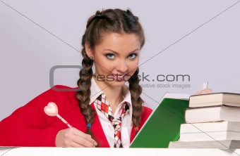 girl sitting in front of books
