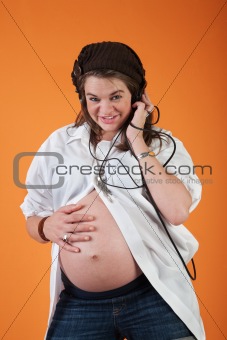 Pregnant Woman Listening To Music