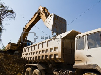 Excavator loader and truck