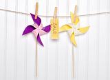 Summer Sale Concept Pinwheels with Sale Sign on Clothesline.