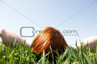 Redhead Laying In Grass Looking Up