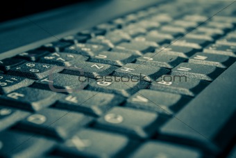 toned background with computer keyboard
