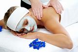 Woman having a massage treatment at a beauty spa 