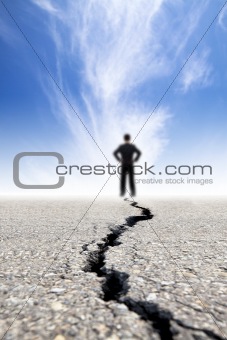 businessman stand on the crack road