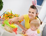 Mother and baby making easter decoration