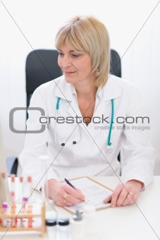 Middle age female doctor at working