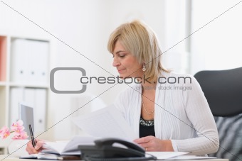 Senior business woman at work