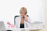 Middle age architect woman having phone call