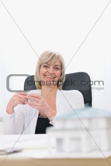 Happy architect woman having coffee break