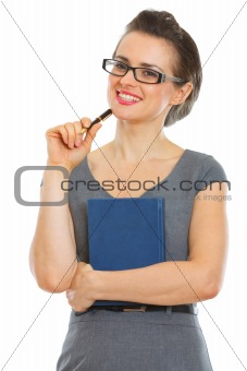 Smiling student woman with notebook and pen