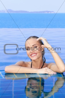 Smiling Woman Reflected In Pool