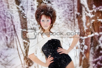 girl with an unusual style in the winter forest