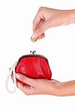 Red wallet and coin in womans hand