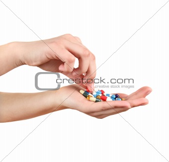 coloured tablets at the hands