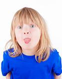 boy with long blond hair sticking out his tongue - isolated on white