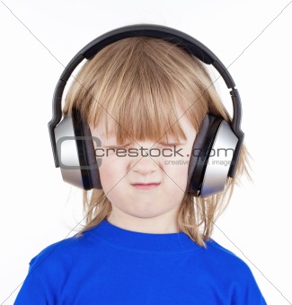 boy with long blond hair listening to music in headphones - isolated on white