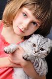 child with her pet cat